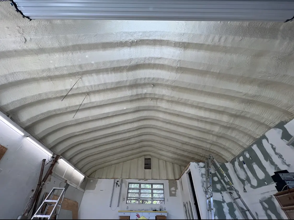 Spray polyurethane foam applied to the underside of a metal roof deck in College